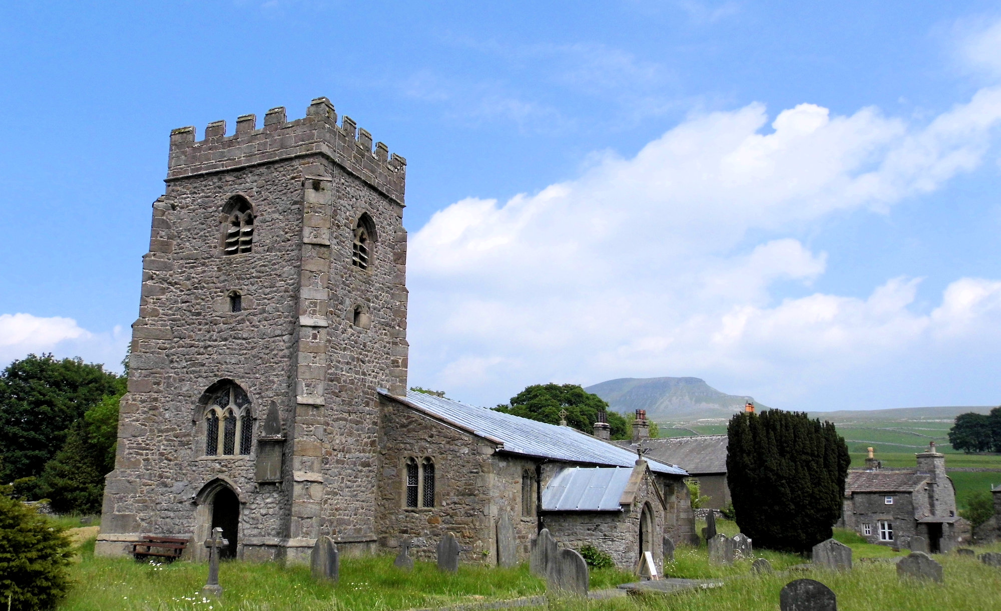 Photo of the view from the churchyard in Horton in Ribblesdale towards Pen-y-Ghent - photo from wikimedia by Steve Kraken